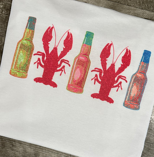 Glitter crawfish and hot sauce